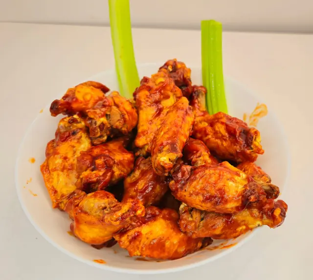 Buffalo wings with celery and blue cheese